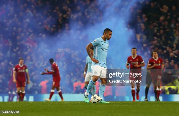 Flare going off whilst Manchester City's Gabriel Jesus waiting to kick off during the UEFA Champions League Quarter Final Second Leg match between...