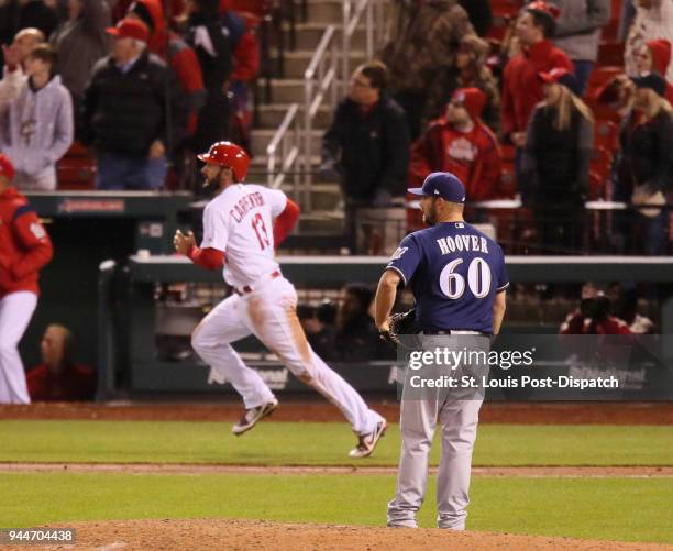 Milwaukee Brewers pitcher J.J. Hoover watches the ball leave the park after St. Louis Cardinals' Matt Carpenter hit a walk-off, two-run home run in...