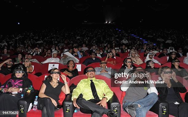 Guests wear 3D glasses as they attend the "Avatar" premiere during day seven of the 6th Annual Dubai International Film Festival held at the Madinat...