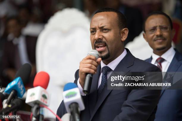 Ethiopia's new Prime Minister Abiy Ahmed delivers a speech during his rally in Ambo, about 120km west of Addis Ababa, Ethiopia, on April 11, 2018. /...