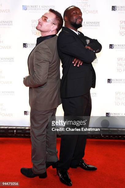 Singer Bono and musician Wyclef Jean attend the RFK Center Ripple of Hope Awards dinner at Pier Sixty at Chelsea Piers on November 18, 2009 in New...