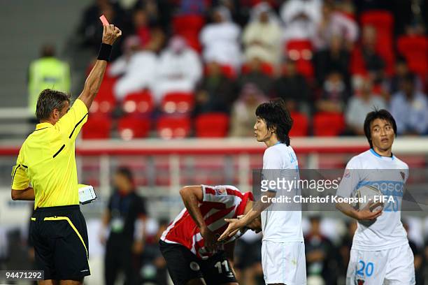 Referee Roberto Rosetti of Italy shows Kim Jae Sung of Pohang Steelers the red card during the FIFA Club World Cup semi-final match between Pohang...