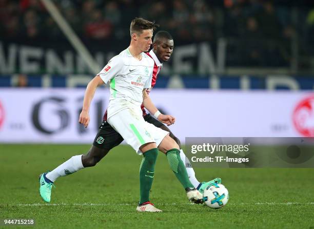 Marco Friedl of Bremen and Ihlas Bebou of Hannover battle for the ball during the Bundesliga match between Hannover 96 and Werder Bremen at HDI Arena...