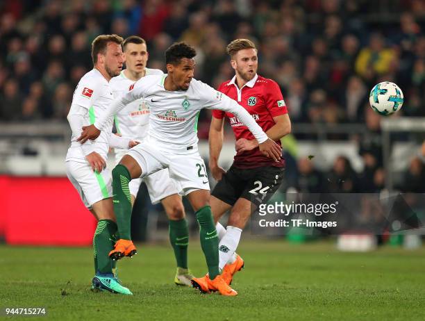 Philipp Bargfrede of Bremen, Maximilian Eggestein of Bremen, Theodor Gebre Selassie of Bremen and Niclas Fuellkrug of Hannover battle for the ball...