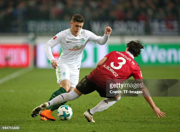 Milot Rashica of Bremen and Miiko Albornoz of Hannover battle for the ball during the Bundesliga match between Hannover 96 and Werder Bremen at HDI...