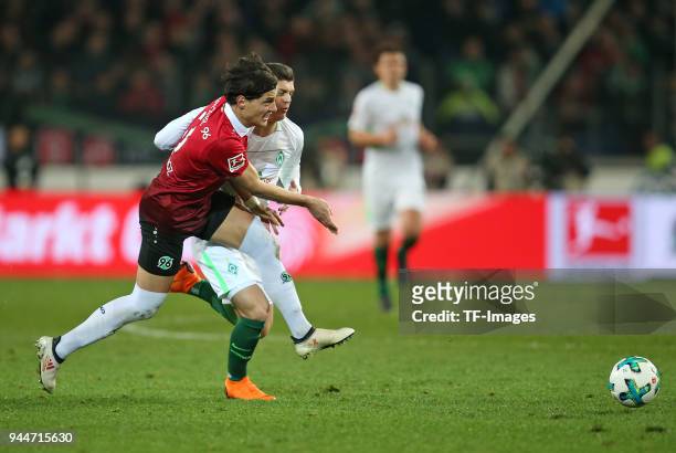 Miiko Albornoz of Hannover and Milot Rashica of Bremen battle for the ball during the Bundesliga match between Hannover 96 and Werder Bremen at HDI...