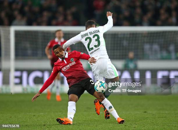 Noah Joel Sarenren Bazee of Hannover and Theodor Gebre Selassie of Bremen battle for the ball during the Bundesliga match between Hannover 96 and...