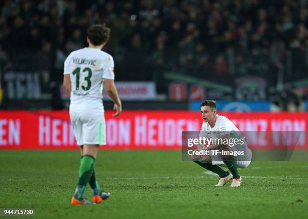 Milos Veljkovic of Bremen and Marco Friedl of Bremen look dejected during the Bundesliga match between Hannover 96 and Werder Bremen at HDI Arena on...