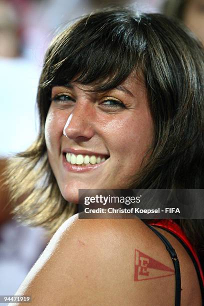 Fan of Estudiantes shows her club logo as a tattoo during the FIFA Club World Cup semi-final match between Pohang Steelers and Estudiantes LP at the...