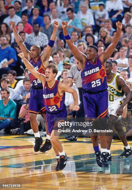Charles Barkley Danny Ainge and Oliver Miller of the Phoenix Suns react against the Seattle SuperSonics during the game 4 of the Western Conference...