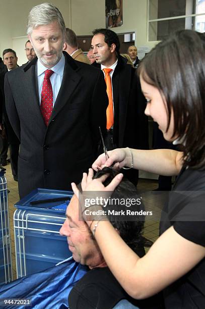 Prince Philippe of Belgium visits a hairdressing course at the Institute Technique Provincial on December 15, 2009 in Mont-Saint-Guibert, Belgium.
