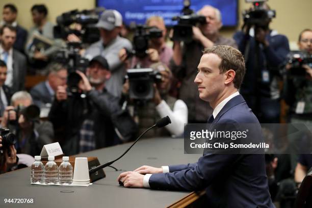 Facebook co-founder, Chairman and CEO Mark Zuckerberg prepares to testify before the House Energy and Commerce Committee in the Rayburn House Office...