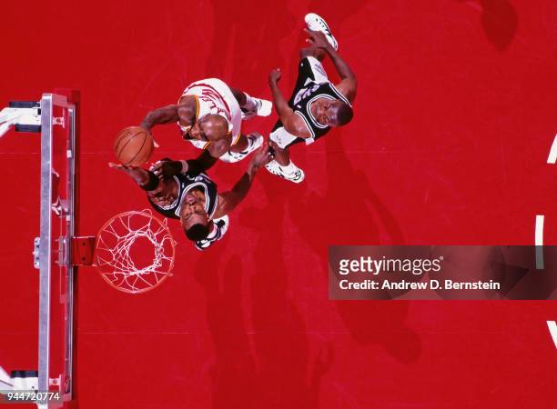 David Robinson of the San Antonio Spurs blocks the shot during the game against the Houston Rockets circa 1993 at the summit in Houston, Texas. NOTE...