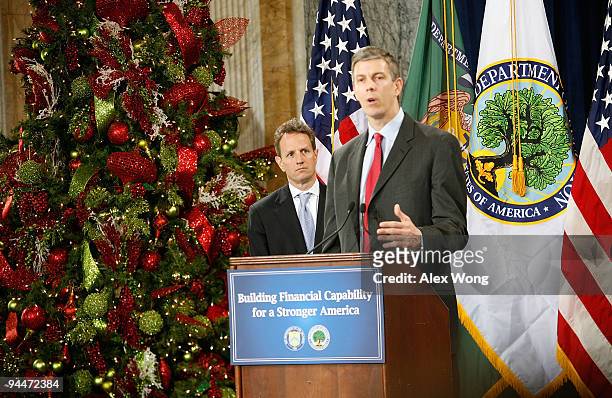 Secretary of Education Arne Duncan speaks as Secretary of the Treasury Timothy Geithner listens during an event to announce a partnership to promote...