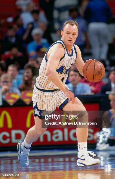 Scott Skiles handles the ball during a game circa 1993 at the Orlando Arena in Orlando Florida. NOTE TO USER: User expressly acknowledges and agrees...