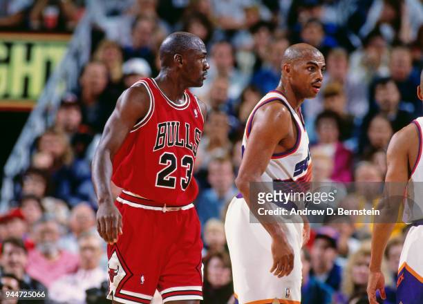 Michael Jordan of the Chicago Bulls and Charles Barkley of the Phoenix Suns look son during the game between the two teams circa 1993 at America West...