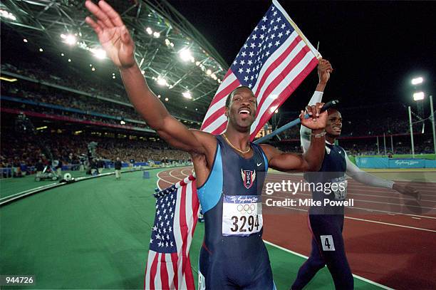 Michael Johnson of the USA celebrates gold alongside compatriot and silver medallist Alvin Harrison after the Mens 400m Final in the Olympic Stadium...