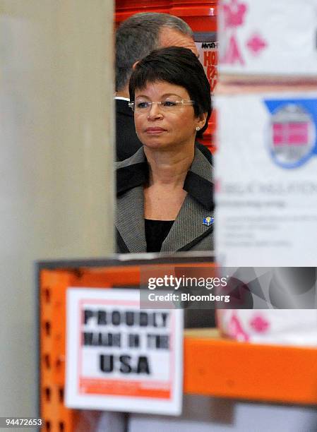Valeria Jarrett, senior advisor to U.S. President Barack Obama, listens to the president at a Home Depot store in Alexandria, Virginia, U.S., on...