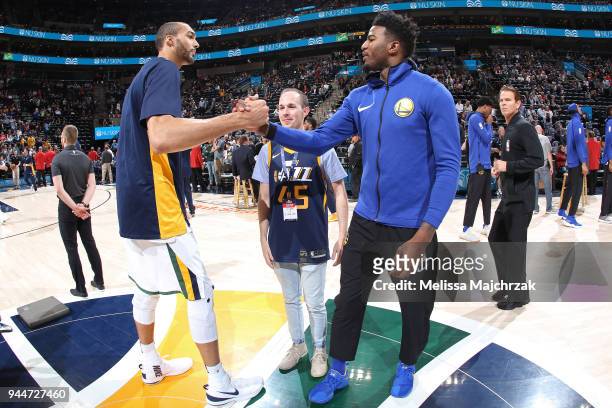 Rudy Gobert of the Utah Jazz and Jordan Bell of the Golden State Warriors shake hands after the game on April 10, 2018 at vivint.SmartHome Arena in...