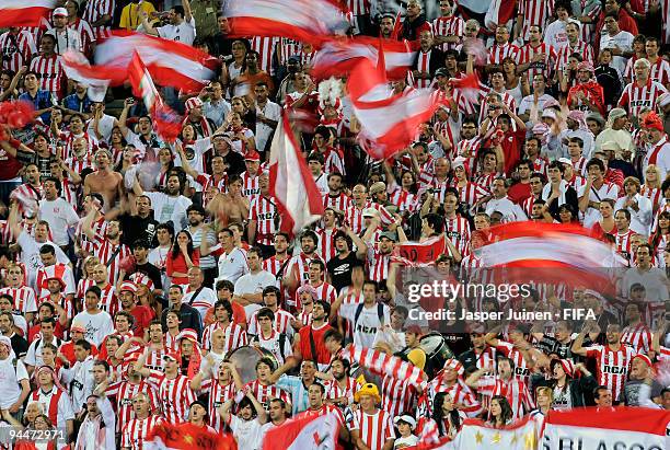 Estudiantes fans celebrate during the FIFA Club World Cup semi-final match between Pohang Steelers and Estudiantes at the Mohammed Bin Zayed Stadium...