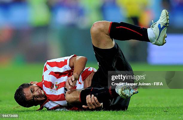 Maxi Nunez of Estudiantes grimaces in pain after being fouled during the FIFA Club World Cup semi-final match between Pohang Steelers and Estudiantes...