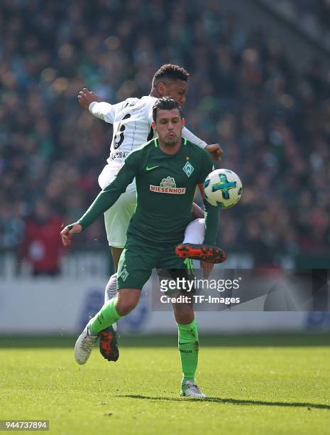 Jonathan de Guzman of Frankfurt and Zlatko Junuzovic of Bremen battle for the ball during the Bundesliga match between Werder Bremen and Eintracht...
