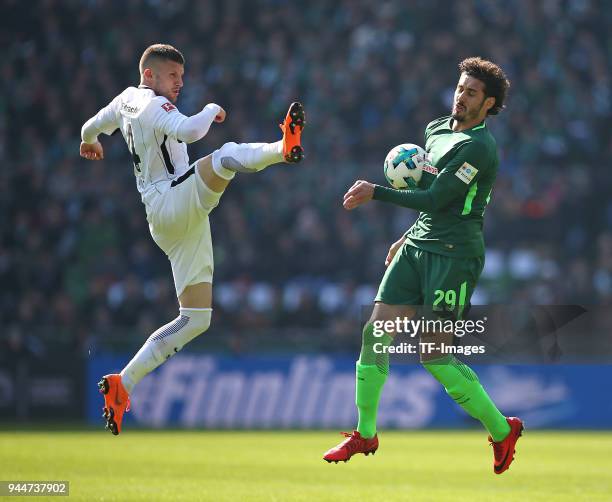 Ante Rebic of Frankfurt and Ishak Belfodil of Bremen battle for the ball during the Bundesliga match between Werder Bremen and Eintracht Frankfurt at...