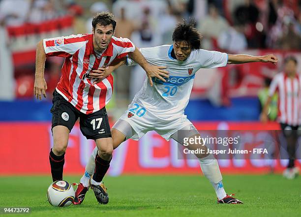 Mauro Boselli of Estudiantes duels for the ball with Hyung Min Shin of Pohang Steelers during the FIFA Club World Cup semi-final match between Pohang...