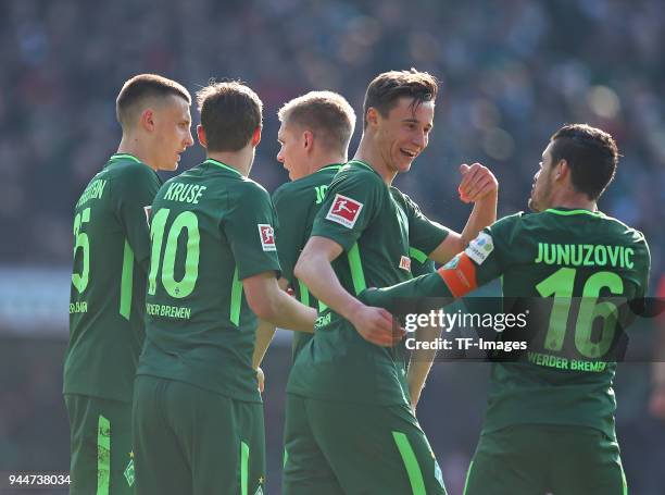 Zlatko Junuzovic of celebrates after scoring his team`s first goal with Maximilian Eggestein of Bremen, Max Kruse of Bremen, Aron Johannsson of...