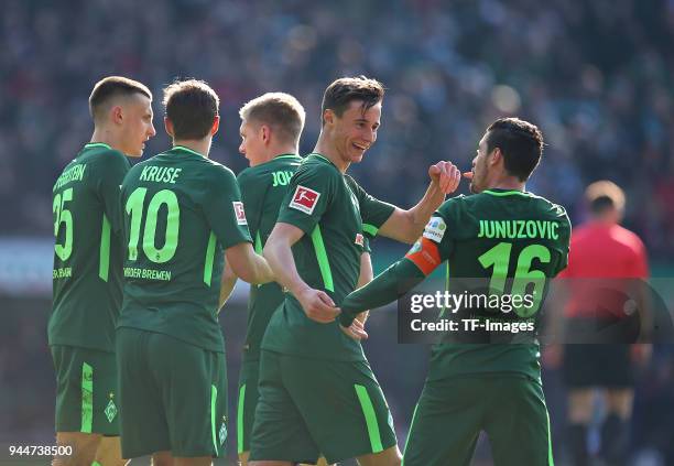 Zlatko Junuzovic of celebrates after scoring his team`s first goal with Maximilian Eggestein of Bremen, Max Kruse of Bremen, Aron Johannsson of...