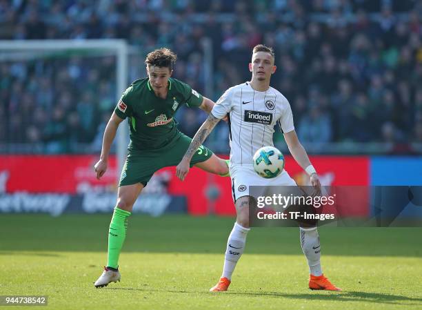 Marco Friedl of Bremen and Marius Wolf of Frankfurt battle for the ball during the Bundesliga match between Werder Bremen and Eintracht Frankfurt at...