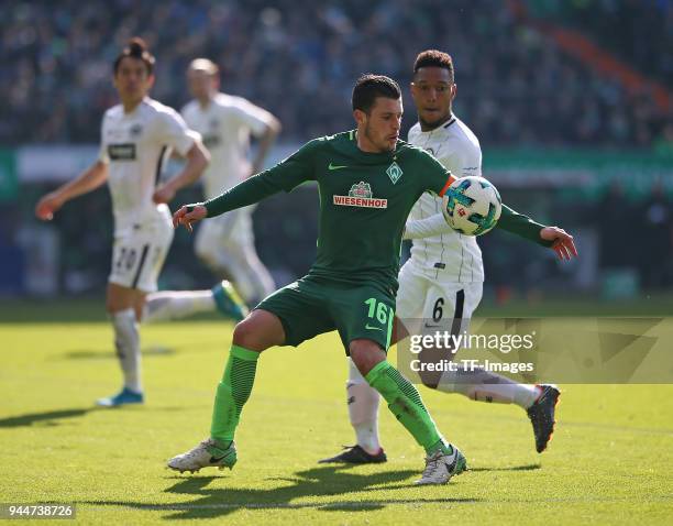 Zlatko Junuzovic of Bremen and Jonathan de Guzman of Frankfurt battle for the ball during the Bundesliga match between Werder Bremen and Eintracht...