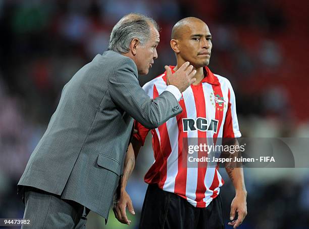 Head coach Alejandro Sabella of Estudiantes instructs Clemente Rodriguez during the FIFA Club World Cup semi-final match between Pohang Steelers and...