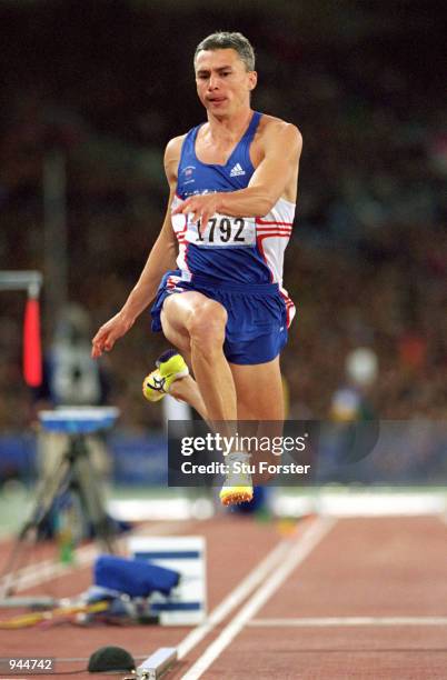 Jonathan Edwards of Great Britain on his way to gold in the Mens Triple Jump at the Olympic Stadium on Day 10 of the Sydney 2000 Olympic Games in...