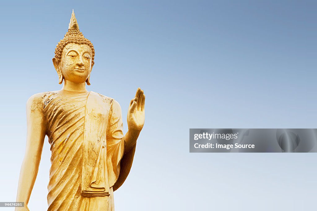 Standing buddha figure in thailand