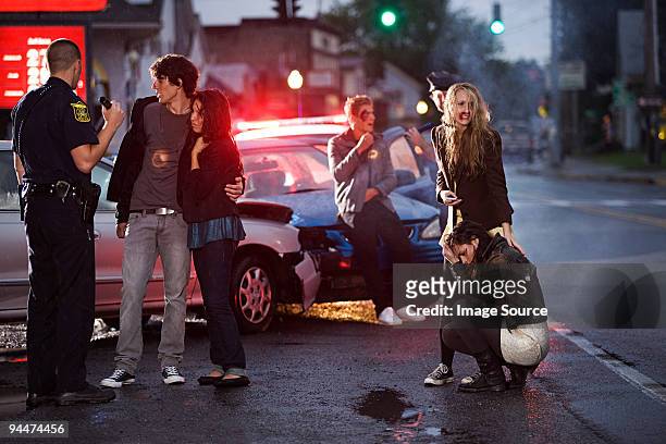young people and police officer at scene of car crash - drunk driving accident stock pictures, royalty-free photos & images