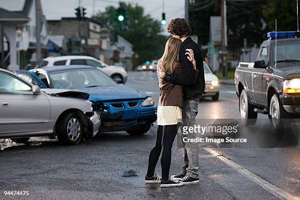 young couple looking at crashed cars - drunk driving accident stock pictures, royalty-free photos & images