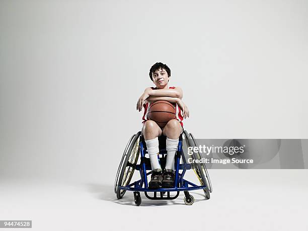 junior wheelchair basketball player - child in wheelchair stock-fotos und bilder