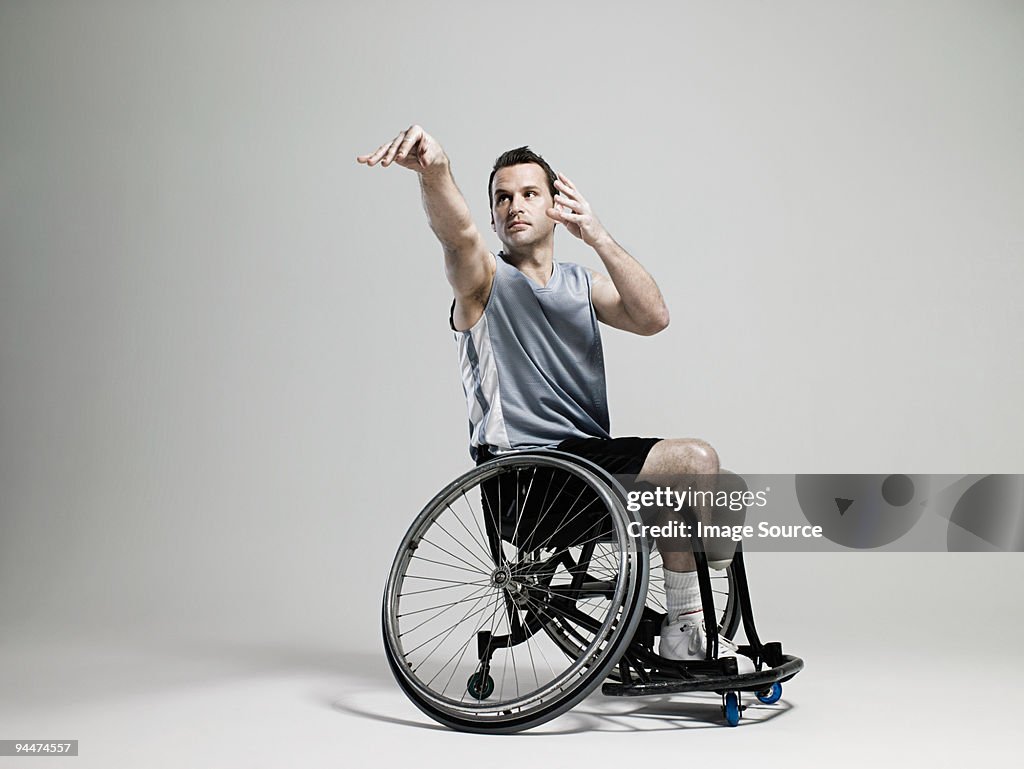 Wheelchair basketball player shooting