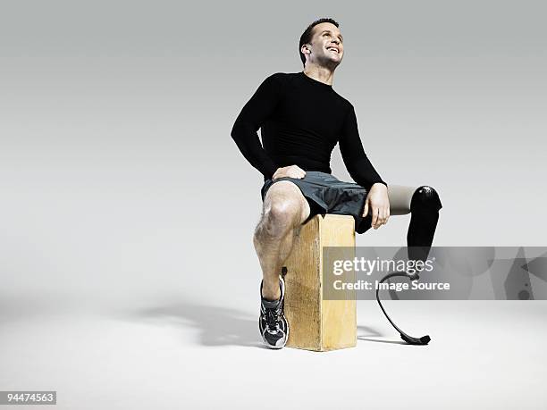 athlete with prosthetic leg - sitting alone stock pictures, royalty-free photos & images