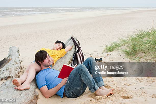 young couple at the beach - southwold stockfoto's en -beelden