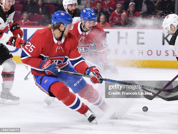 Jacob De La Rose of the Montreal Canadiens passes the puck against the New Jersey Devils in the NHL game at the Bell Centre on April 1, 2018 in...