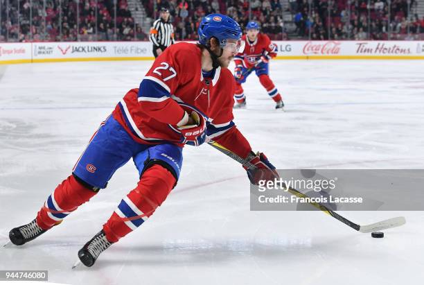 Alex Galchenyuk of the Montreal Canadiens looks to pass the puck against the New Jersey Devils in the NHL game at the Bell Centre on April 1, 2018 in...