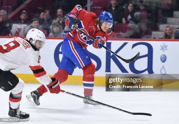 Jacob De La Rose of the Montreal Canadiens fires a shot against the New Jersey Devils in the NHL game at the Bell Centre on April 1, 2018 in...