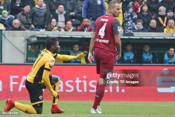Moussa Kone of Dresden and Ewerton of Nuernberg look on during the Second Bundesliga match between SG Dynamo Dresden and 1. FC Nuernberg at...