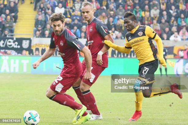 Enrico Valentini of Nuernberg and Moussa Kone of Dresden battle for the ball during the Second Bundesliga match between SG Dynamo Dresden and 1. FC...