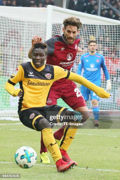 Moussa Kone of Dresden and Enrico Valentini of Nuernberg battle for the ball during the Second Bundesliga match between SG Dynamo Dresden and 1. FC...