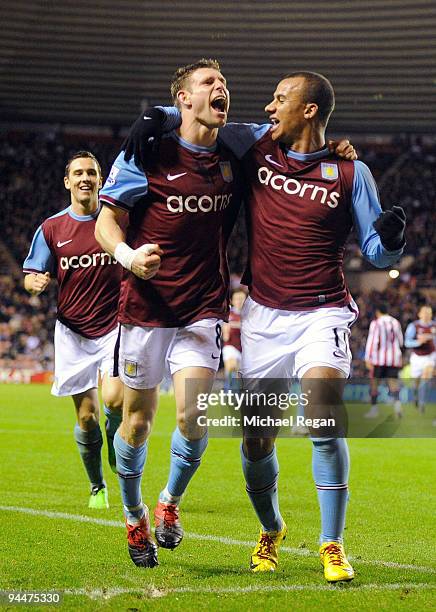 James Milner of Aston Villa celebrates scoring with Gabriel Agbonlahor during the Barclays Premier League match between Sunderland and Aston Villa at...