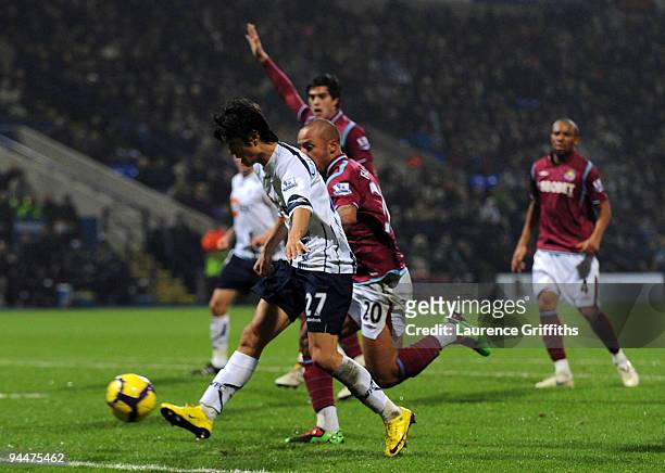 Chung-Yong Lee of Bolton scores the first goal during the Barclays Premier League match between Bolton Wanderers and West Ham United at The Reebok...