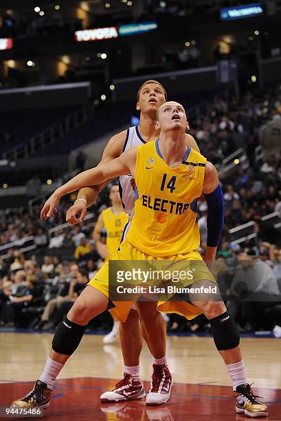Maciej Lampe of the Maccabi Electra Tel Aviv and Blake Griffin of the Los Angeles Clippers battle for position during a preseason game at Staples...